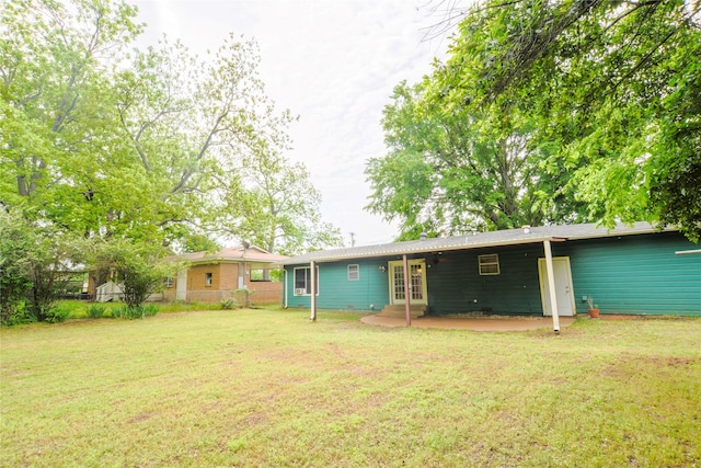 1915 W Bond St, Denison, TX 75020 - rear view of property with a lawn, a patio area, french doors, and fence