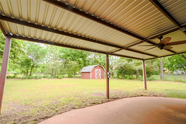 1915 W Bond St, Denison, TX 75020 - view of yard featuring an outbuilding, fence, ceiling fan, a patio area, and a storage unit