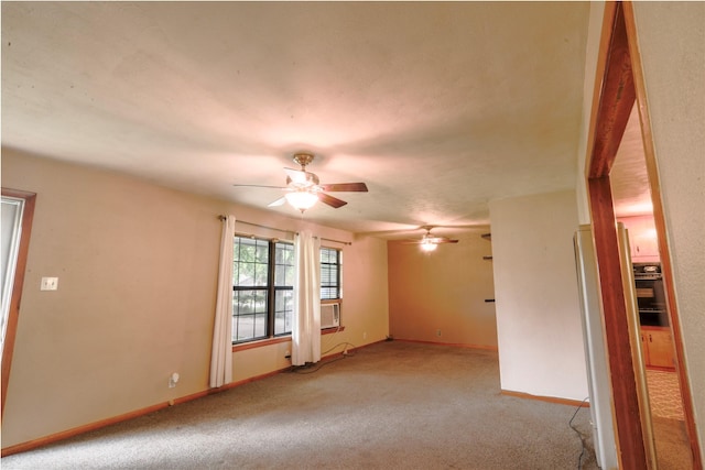 1915 W Bond St, Denison, TX 75020 - unfurnished room featuring light colored carpet, baseboards, and a ceiling fan