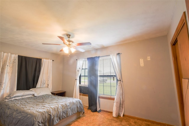 1915 W Bond St, Denison, TX 75020 - bedroom with ceiling fan, light carpet, baseboards, and a closet