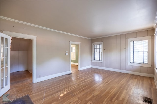 2234 Idlewild St, Abilene, TX 79605 - unfurnished room featuring crown molding, baseboards, and wood finished floors