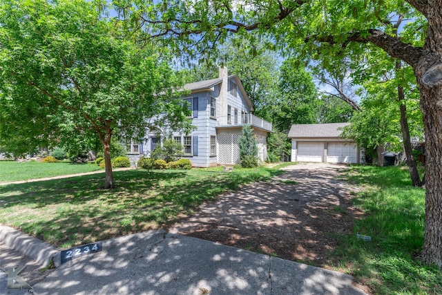 2234 Idlewild St, Abilene, TX 79605 - view of front of home featuring an outbuilding, a chimney, a balcony, a garage, and a front yard