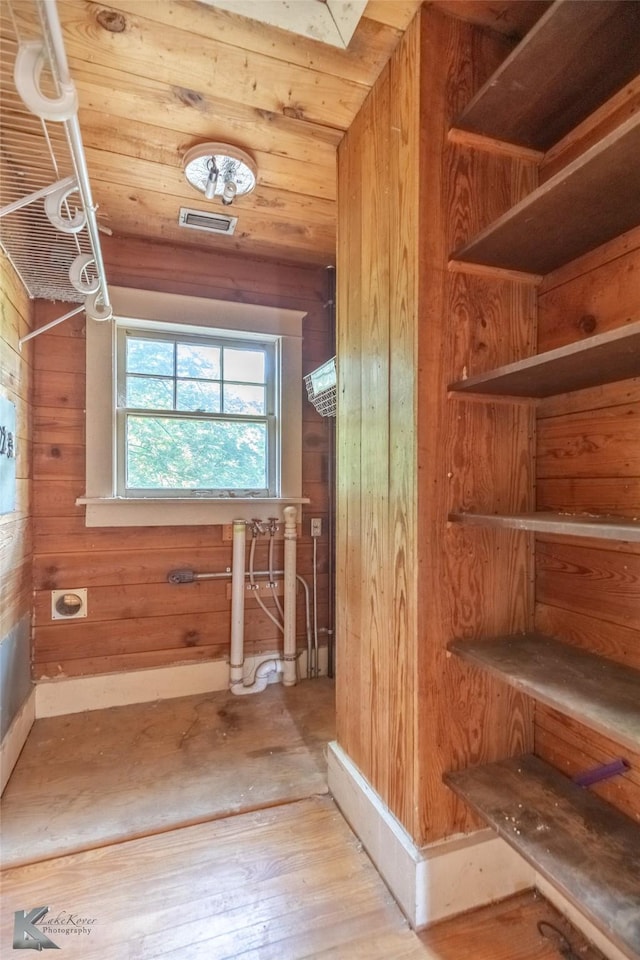 2234 Idlewild St, Abilene, TX 79605 - additional living space with wood walls and hardwood / wood-style floors