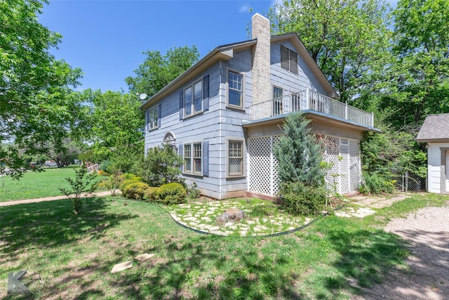 2234 Idlewild St, Abilene, TX 79605 - view of home's exterior featuring a balcony, a chimney, and a yard