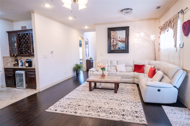 5117 Wakefield Dr, Irving, TX 75038 - living room with visible vents, hardwood / wood-style flooring, arched walkways, and bar area