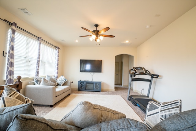 5117 Wakefield Dr, Irving, TX 75038 - carpeted living room featuring arched walkways, a ceiling fan, visible vents, and recessed lighting