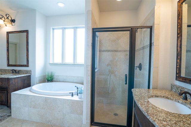 5117 Wakefield Dr, Irving, TX 75038 - bathroom featuring a sink, two vanities, a shower stall, and a bath
