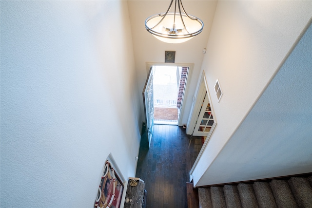 5117 Wakefield Dr, Irving, TX 75038 - staircase featuring visible vents, wood finished floors, and a towering ceiling