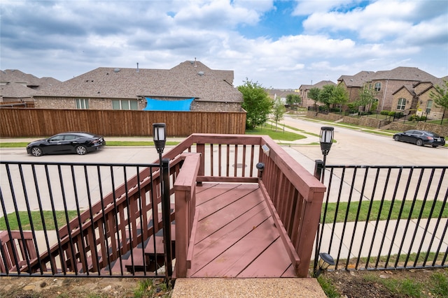 5117 Wakefield Dr, Irving, TX 75038 - wooden terrace featuring fence and a residential view