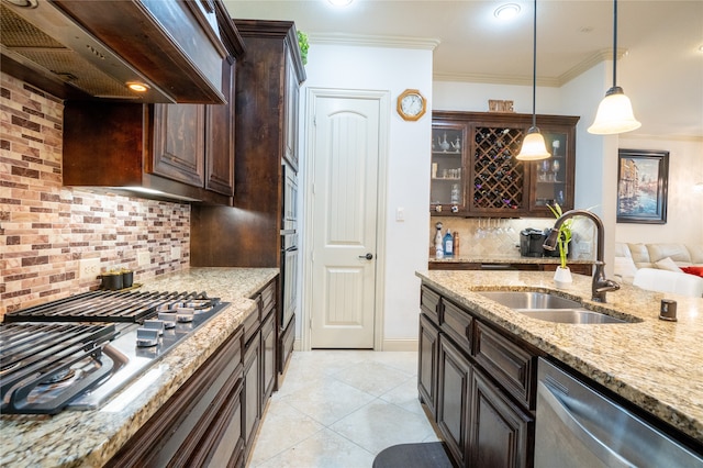5117 Wakefield Dr, Irving, TX 75038 - kitchen featuring a sink, stainless steel appliances, under cabinet range hood, dark brown cabinetry, and decorative backsplash
