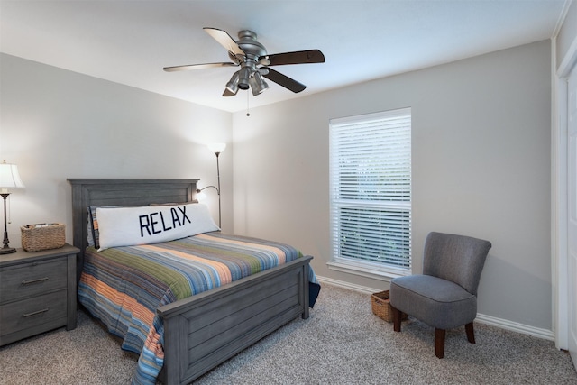 bedroom with baseboards, carpet flooring, and a ceiling fan