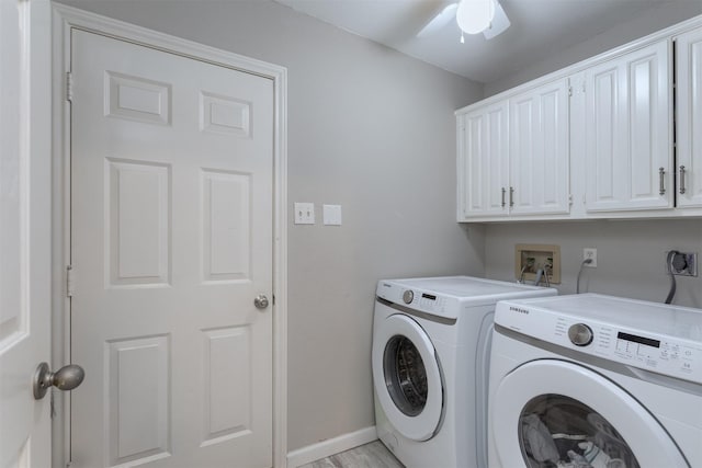 laundry room featuring cabinet space, a ceiling fan, washing machine and dryer, baseboards, and light wood-style floors