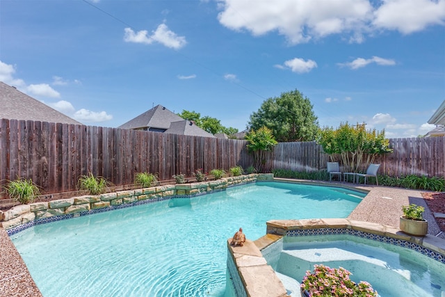 view of pool featuring an in ground hot tub, a fenced backyard, and a fenced in pool