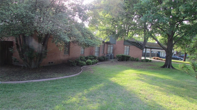 1509 N Gaines St, Ennis, TX 75119 - view of grassy yard with central AC unit