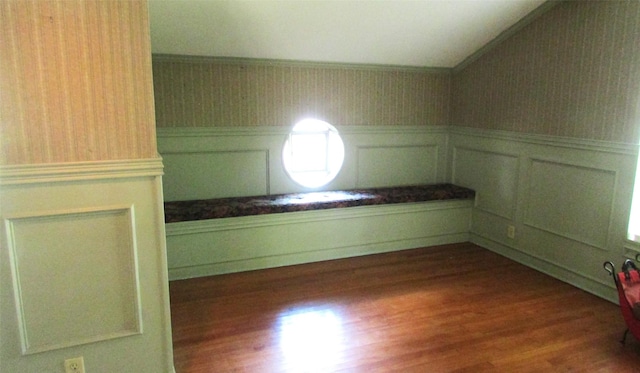 1509 N Gaines St, Ennis, TX 75119 - bonus room featuring wallpapered walls, vaulted ceiling, a wainscoted wall, and wood finished floors