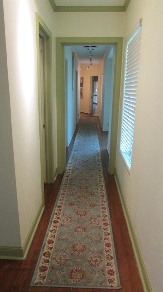 1509 N Gaines St, Ennis, TX 75119 - hall with wood finished floors and baseboards