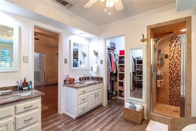 1307 S Westador Dr, Arlington, TX 76015 - bathroom with vanity, a stall shower, and wainscoting
