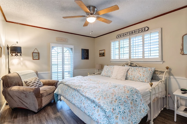 1307 S Westador Dr, Arlington, TX 76015 - bedroom featuring dark wood-type flooring, multiple windows, a textured ceiling, ornamental molding, and ceiling fan