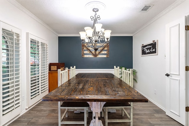 1307 S Westador Dr, Arlington, TX 76015 - dining area with a chandelier, dark wood-type flooring, ornamental molding, and a textured ceiling