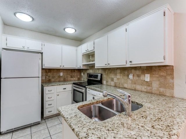 4242 N Capistrano Dr Unit 203, Dallas, TX 75287 - kitchen featuring a sink, white cabinetry, a textured ceiling, light stone countertops, and white appliances