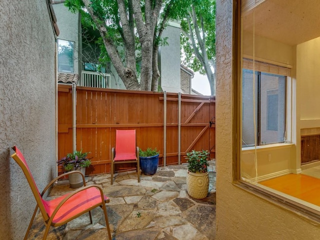4242 N Capistrano Dr Unit 203, Dallas, TX 75287 - view of patio / terrace featuring fence