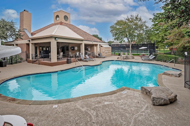 4242 N Capistrano Dr Unit 203, Dallas, TX 75287 - pool with a patio and fence