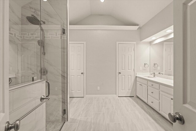 bathroom with a shower stall, lofted ceiling, vanity, recessed lighting, and baseboards
