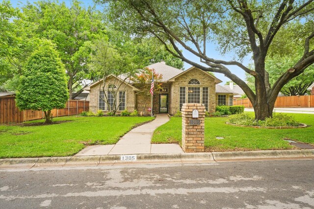 view of front of home featuring brick siding