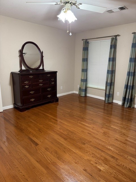 7249 Peden Rd, Azle, TX 76020 - unfurnished bedroom with visible vents, wood finished floors, and baseboards
