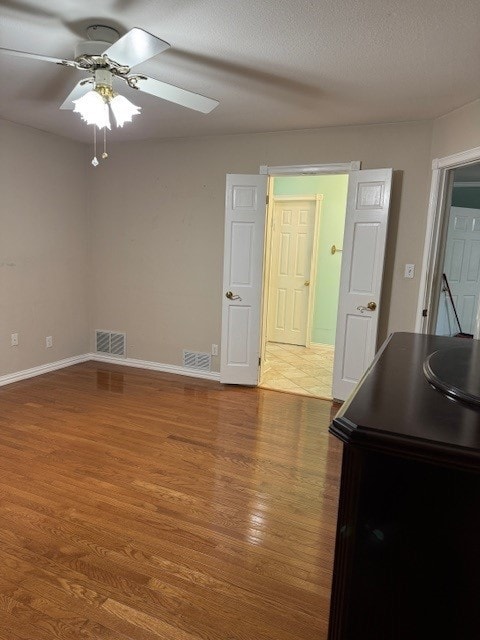 7249 Peden Rd, Azle, TX 76020 - interior space featuring baseboards, a ceiling fan, visible vents, and wood finished floors