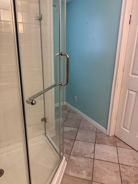7249 Peden Rd, Azle, TX 76020 - bathroom featuring baseboards, a stall shower, and tile patterned flooring