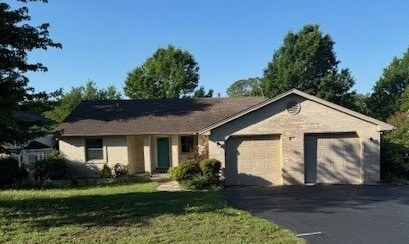 7249 Peden Rd, Azle, TX 76020 - ranch-style home featuring a front yard, driveway, and a garage
