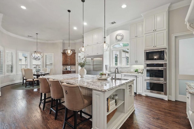 120 Quiet Hill Cir, Copper Canyon, TX 76226 - kitchen featuring built in appliances, white cabinetry, backsplash, recessed lighting, and crown molding