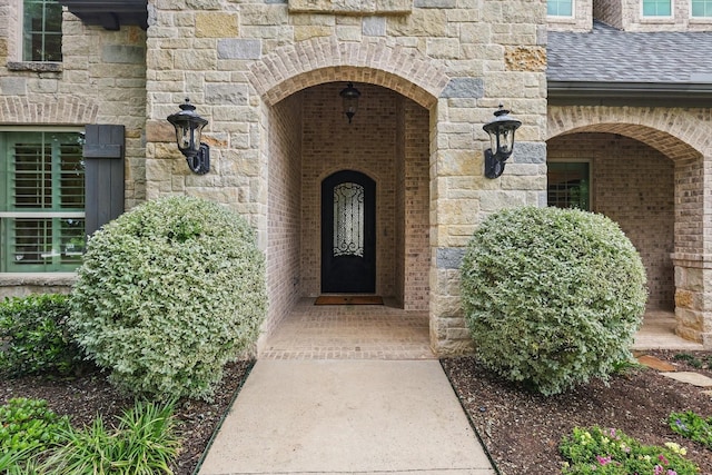 120 Quiet Hill Cir, Copper Canyon, TX 76226 - property entrance with stone siding, a shingled roof, and brick siding