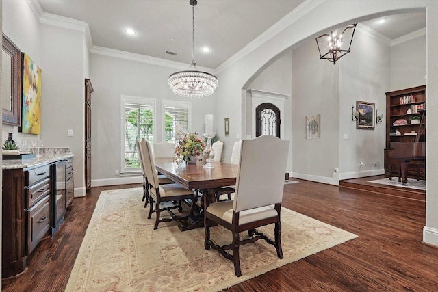 120 Quiet Hill Cir, Copper Canyon, TX 76226 - dining area with a chandelier, arched walkways, wine cooler, dark wood-style flooring, and crown molding
