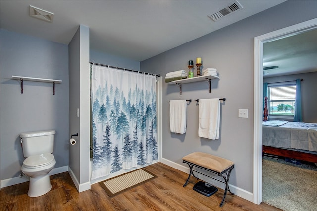 185 Seminole Trl, East Tawakoni, TX 75472 - bathroom with toilet, a shower with curtain, and visible vents