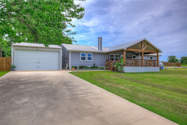 185 Seminole Trl, East Tawakoni, TX 75472 - ranch-style home featuring metal roof, driveway, a garage, and a front yard