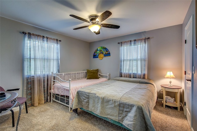 185 Seminole Trl, East Tawakoni, TX 75472 - bedroom with carpet flooring, multiple windows, and a ceiling fan