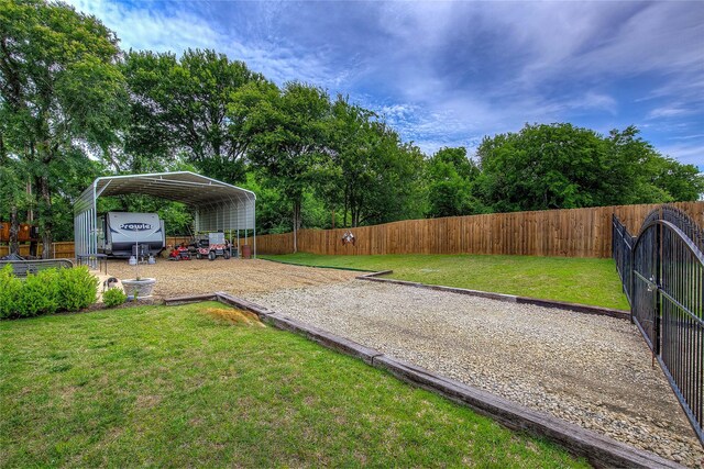 185 Seminole Trl, East Tawakoni, TX 75472 - view of yard with a detached carport, fence, and gravel driveway