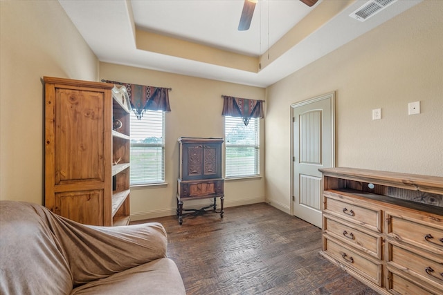 360 Rs County Road 3419, Emory, TX 75440 - bedroom featuring dark wood finished floors, baseboards, a tray ceiling, and a ceiling fan