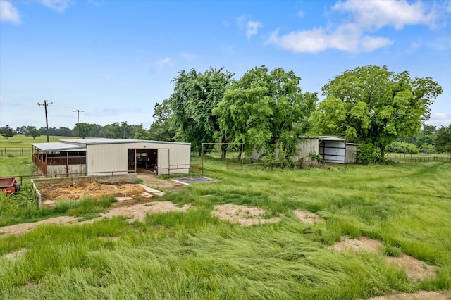 360 Rs County Road 3419, Emory, TX 75440 - view of yard featuring a pole building, an outdoor structure, an exterior structure, and fence