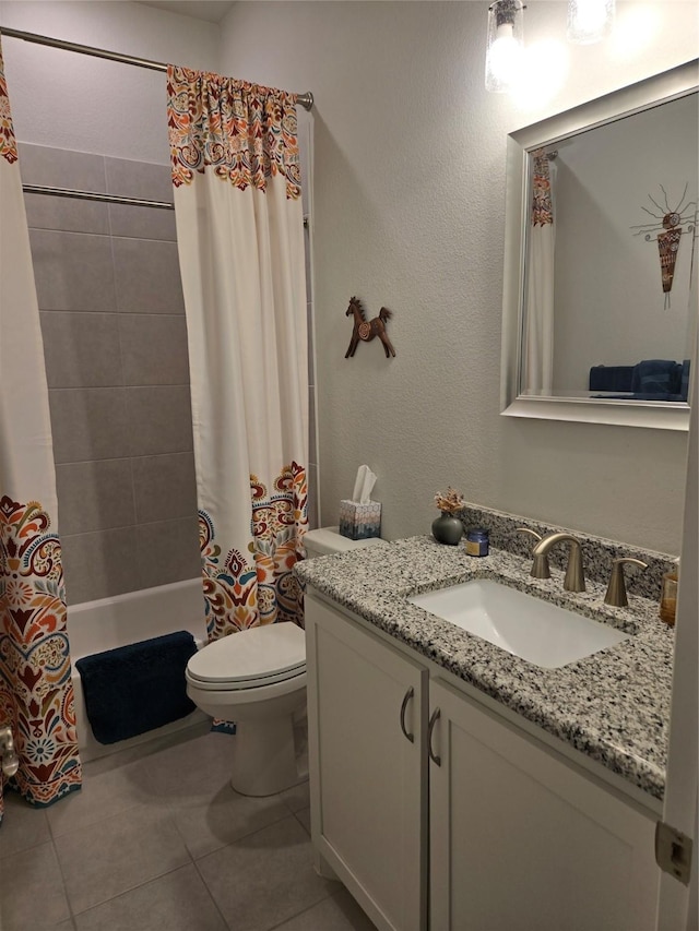 bathroom with toilet, tile patterned flooring, vanity, and shower / bath combination with curtain