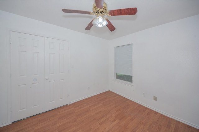1022 Wootton Ave, Bridgeport, TX 76426 - unfurnished bedroom featuring a ceiling fan, baseboards, light wood-type flooring, and a closet