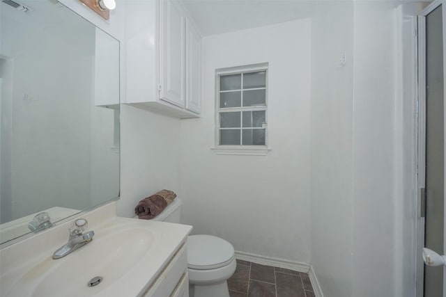 1022 Wootton Ave, Bridgeport, TX 76426 - bathroom featuring vanity, toilet, baseboards, and visible vents