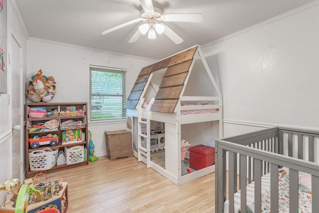 801 Dalton Dr, Princeton, TX 75407 - bedroom featuring ceiling fan, crown molding, a textured ceiling, and wood finished floors
