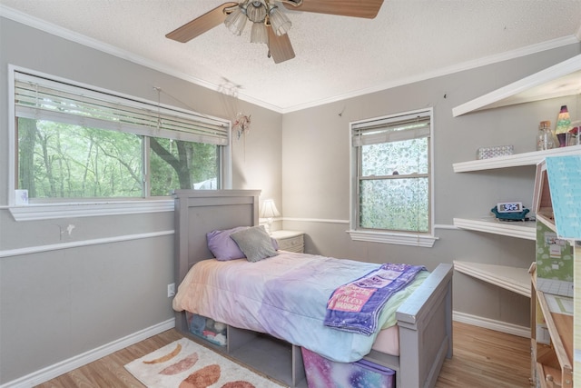 801 Dalton Dr, Princeton, TX 75407 - bedroom with baseboards, ornamental molding, a textured ceiling, and wood finished floors