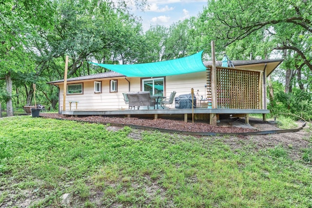 801 Dalton Dr, Princeton, TX 75407 - rear view of property with a yard and a wooden deck