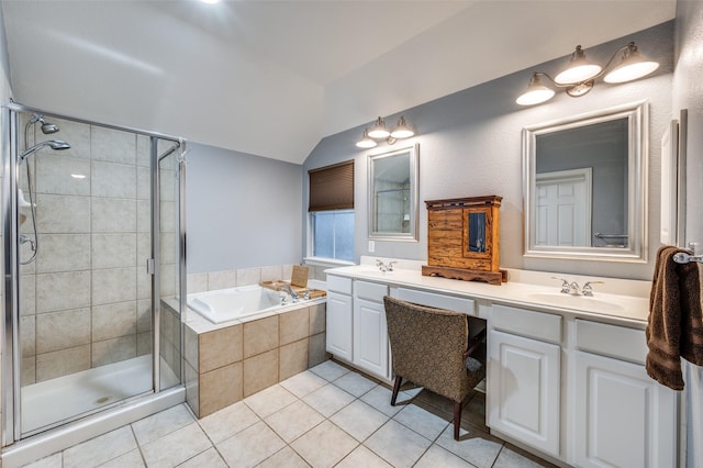 bathroom with lofted ceiling, a bath, a sink, a shower stall, and tile patterned floors