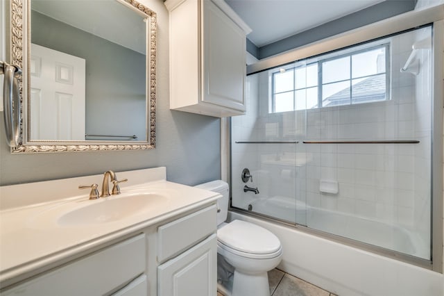 full bathroom with toilet, vanity, and combined bath / shower with glass door