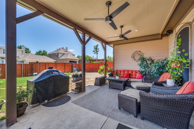view of patio featuring an outdoor hangout area, ceiling fan, a fenced backyard, and grilling area